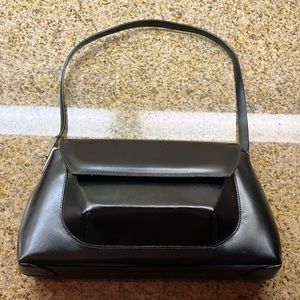 Smooth black Francesco Biasia Italy handbag. Never used. Beautiful!!!